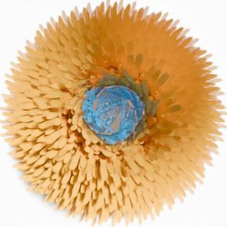 PaintShed flower with pale gold petals and a blue centre